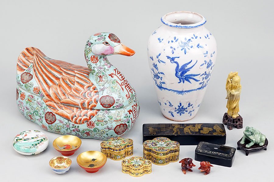 A Collection of Decorative Items.: A Collection of Decorative Items. Comprising a porcelain goose form box, a blue and white porcelain vase, a set of three champleve enamel boxes, a carved jade frog, two carnelian rabbits, and various