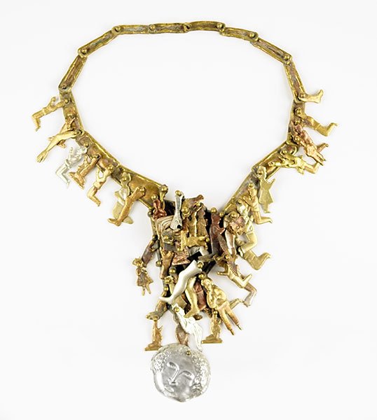 A Pal Kepenyes Milagros Necklace.: A Pal Kepenyes Milagros Necklace. Containing various mixed metal folk charms. Signed on reverse Length: 17" Widest Point: 5"