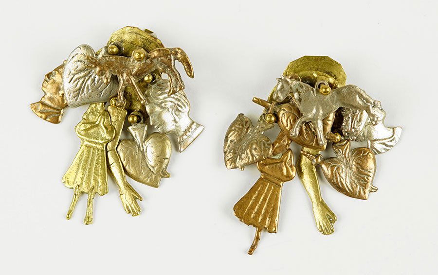 A Pair Of Pal Kepenyes Mixed Metal Earclips.: A Pair Of Pal Kepenyes Mixed Metal Earclips. Comprising articulated horse, heart, and human forms suspended from a central plate. Unsigned Length: 2.5"