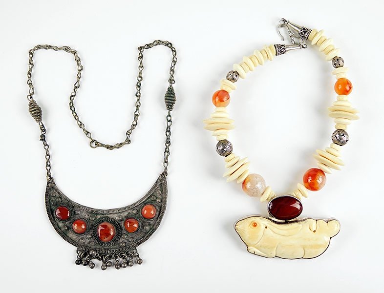 A Carnelian, Agate, And Sterling Silver Pendant: A Carnelian, Agate, And Sterling Silver Pendant Necklace. Comprising alternating bone, silver, and agate beads throughout the neckpiece, suspended from which is a carved rabbit form placed under a cab