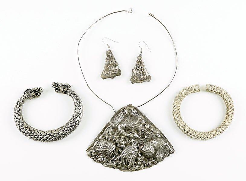 A Chinese Pierced Metal Pendant Necklace.: A Chinese Pierced Metal Pendant Necklace. Comprising a wire choker necklace, suspended from which is a pierced metal pendant depicting a bird and flowers. Together with two Chinese bracelets and a pai
