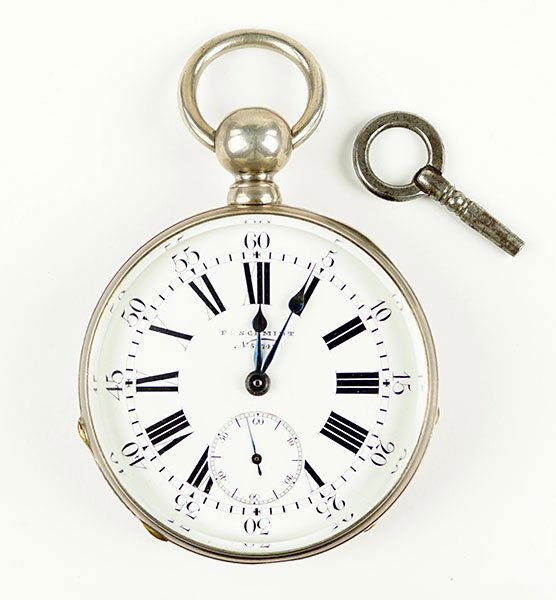 An Open Face Travel Clock.: An Open Face Travel Clock. In the form of a pocket watch. Face reads "F. Schmidt 52747". Back of case is stamped on the interior "52747". Movement cover is engraved "No 52747 Ancora Linea Recta Espira