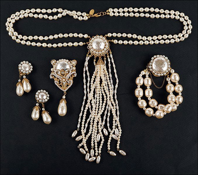 A Miriam Haskell Faux Baroque Pearl Parure.: A Miriam Haskell Faux Baroque Pearl Parure. Comprising a double strand necklace, a double strand bracelet, a brooch with articulated drop, and a pair of earclips