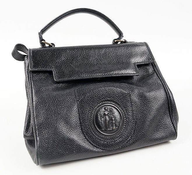 A Fendi Black Leather Handbag.: A Fendi Black Leather Handbag. Bearing a central leather medallion, blue suede lining, and goldtone hardware 9" x 10"