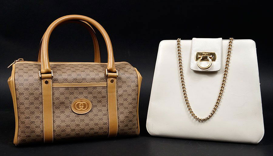 A Savatore Ferragamo White Leather Shoulder Bag.: A Savatore Ferragamo White Leather Shoulder Bag. Bearing goltone chain link shoulder strap and goldtone hardware. Together a Gucci signature monogram canvas handbag measuring 6.5" x 10" x 5" Ferragamo