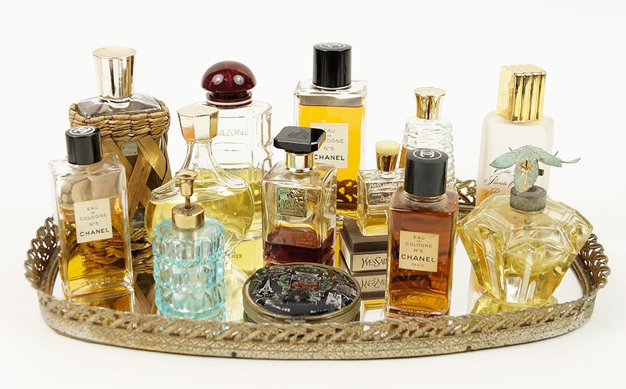 A Collection Of Perfume And Cologne Bottles.: A Collection Of Perfume And Cologne Bottles. Comprising four Chanel Number 5 in various sizes, Hermes 'Amazone,' YSL 'Y', Lanvin 'My Sin', Nina Ricci 'Farouche', Evyan 'Most Precious', two compacts, t