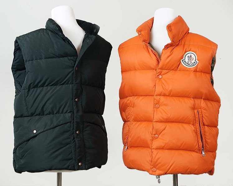 An Orange Moncler Down Vest.: An Orange Moncler Down Vest. Size 3. Together with a Michael Bastian black down vest in a size Medium