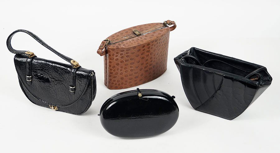 A Gianni Versace Black Leather and Alligator Skin: A Gianni Versace Black Leather and Alligator Skin Handbag. Together with a black embossed leather handbag, a brown embossed leather handbag, and a black clutch