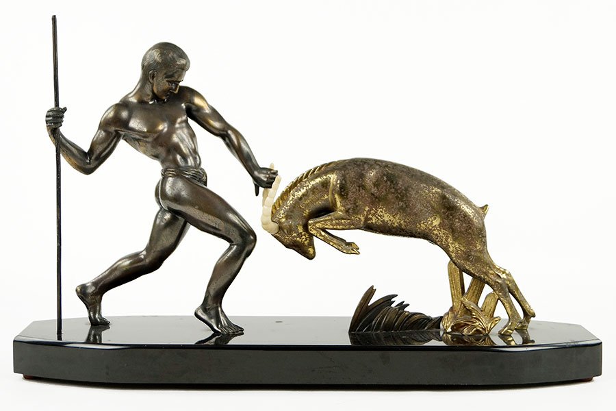 An Art Deco Bronze Figural Group.: An Art Deco Bronze Figural Group. Depicting a man with a spear and a leaping gazelle. Raised on a 1.5" marble base measuring 24.5" in width Figure Height: 13.5"