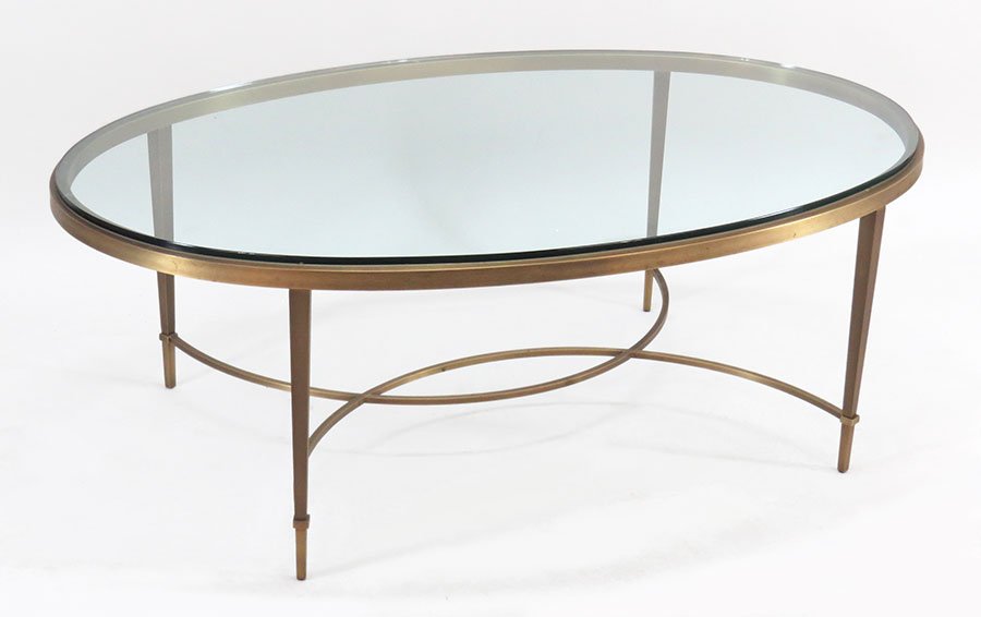 A Baker Brushed Metal Oval Cocktail Table.: A Baker Brushed Metal Oval Cocktail Table. "Chloe" table from the Thomas Pheasant Collection 17" x 49" x 31"