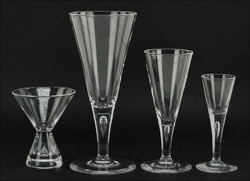 A Steuben Crystal Stemware Service.: A Steuben Crystal Stemware Service. Comprising of eleven water goblets, seven wine goblets, eleven cordials, and seven martini goblets. Together with six Steuben Marshall Field's boxes