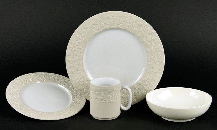 A French Porcelain Dinner Service.: A French Porcelain Dinner Service. Comprising nine dinner plates, nine salad plates, and eight mugs. Together with a set of ten French porcelain bowls