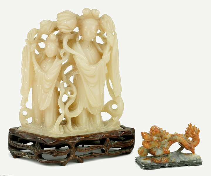 A Carved Soapstone Figural Group. (1 of 2)