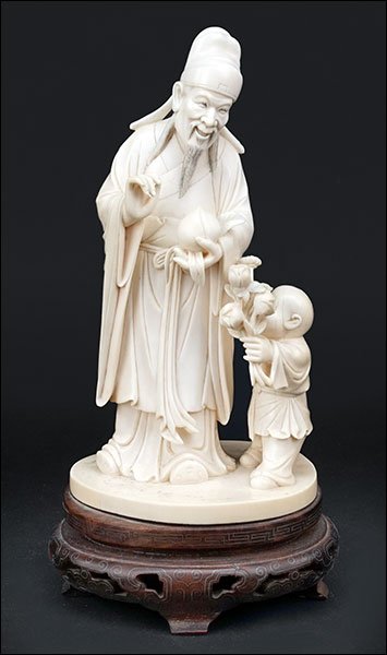 A 19th Century Chinese Carved Ivory Figural Group. (1 of 2)