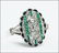 An Art Deco Platinum, Diamond, and Emerald Ring.