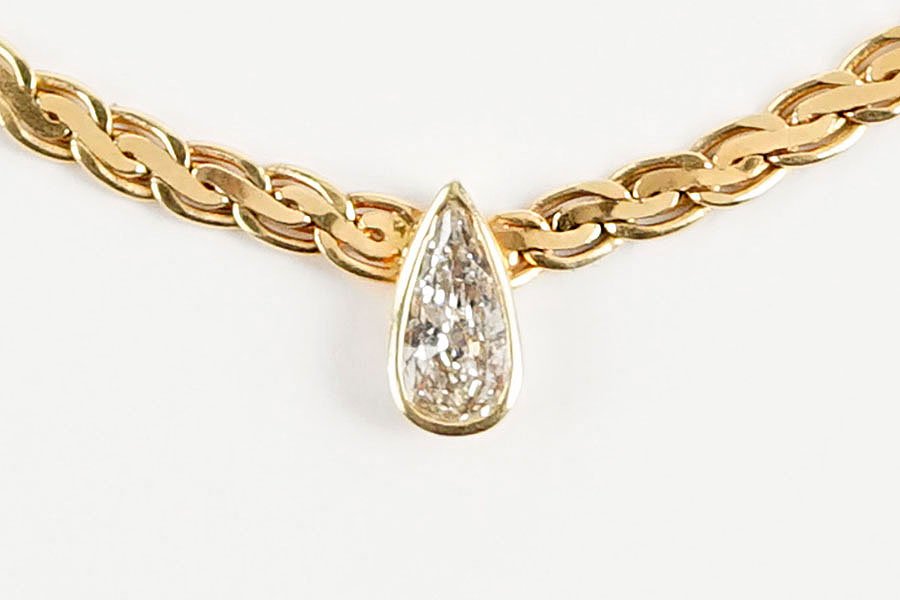 A Diamond And 14 Karat Yellow Gold Woven Link Necklace. (1 of 2)