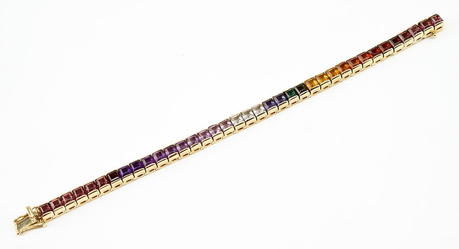 A Gem Set 14 Karat Yellow Gold Line Bracelet. (1 of 2)