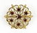 A Victorian Garnet And 14 Karat Yellow Gold Brooch.