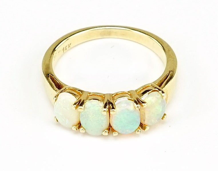 An Opal And 14 Karat Yellow Gold Ring. (1 of 2)