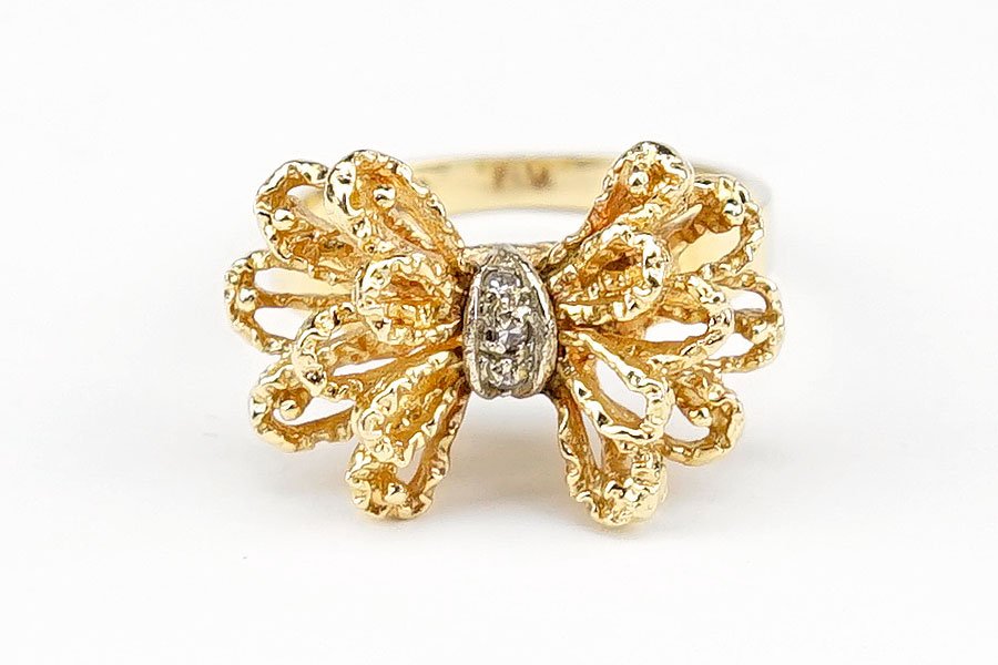 A Diamond And 14 Karat Yellow Gold Ring. (1 of 1)