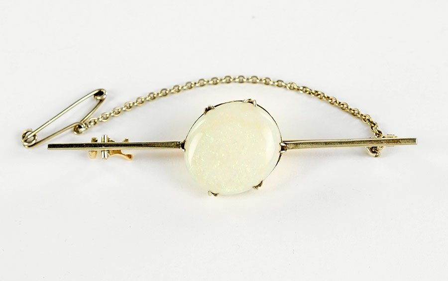 An 18 Karat Yellow Gold And Opal Bar Pin. (1 of 1)