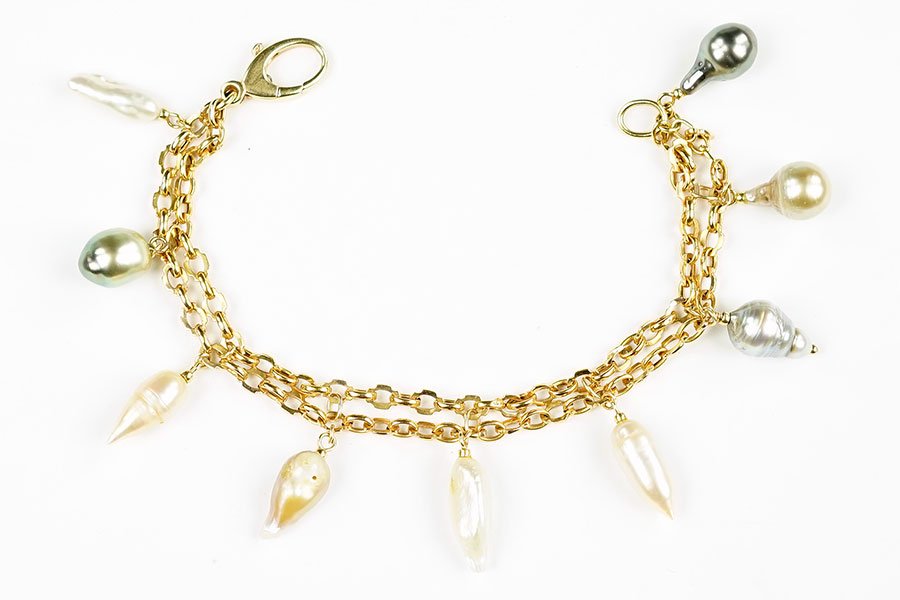 A Cultured Pearl and 14 Karat Yellow Gold Bracelet. (1 of 2)