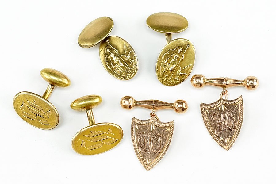 A Pair Of Edwardian 9 Karat Yellow Gold Shield Form: A Pair Of Edwardian 9 Karat Yellow Gold Shield Form Cufflinks. Together with a pair of gold filled cufflinks depicting Joan of Arc and an additional pair of Victorian gold filled cufflinks Shield: .75