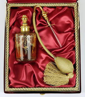 An Annick Goutal for Baccarat Perfume Bottle.: An Annick Goutal for Baccarat Perfume Bottle. Gardenia Passion perfume. Baccarat crystal atomizer bottle bears gilt decoration throughout. Side of bottle is signed, and the neck of the bottle is numbe