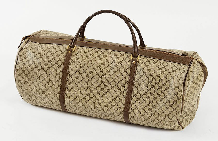A Gucci Monogram Canvas And Leather Duffle Suitcase. (1 of 1)