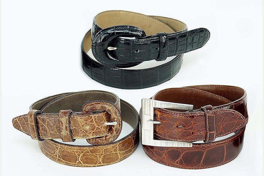 A Ralph Lauren Alligator and Sterling Silver Belt.: A Ralph Lauren Alligator and Sterling Silver Belt. Size: 30. Together with a black alligator belt (Size: M), and a brown alligator belt (Size: 30)