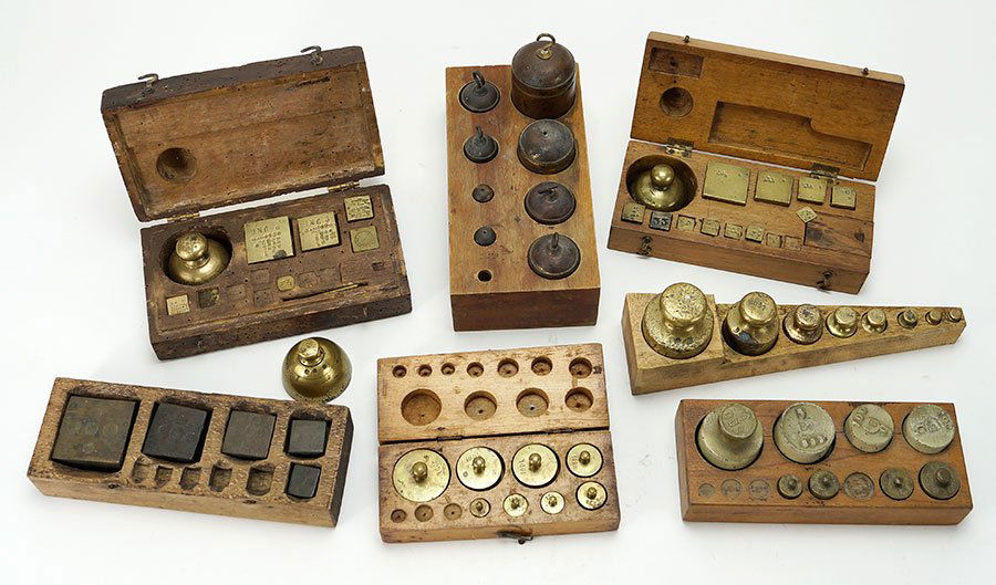 A Collection Of Seven Scale Weights.: A Collection Of Seven Scale Weights. Seven sets of scale weights, three boxed sets, four open sets, several are missing weights