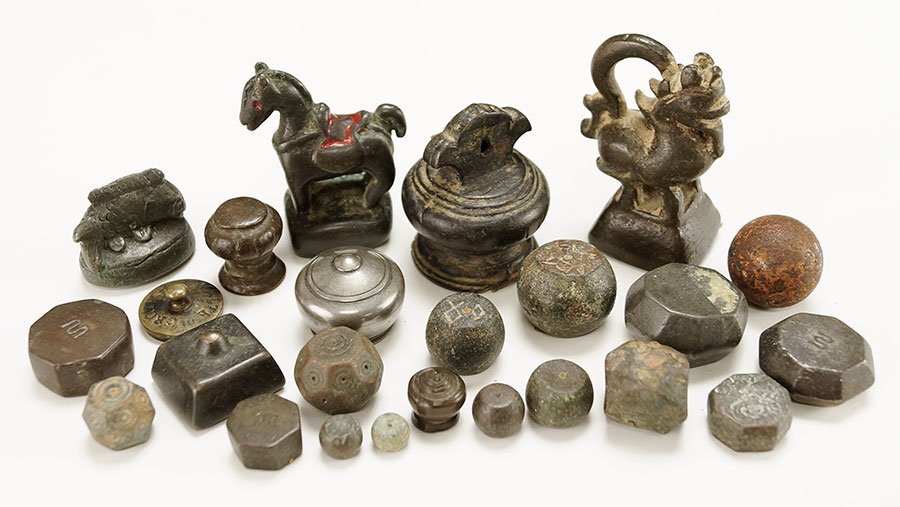 A Collection Of Small Weights.: A Collection Of Small Weights. Small weights include figural, rounds, possible metal game dice and other weights