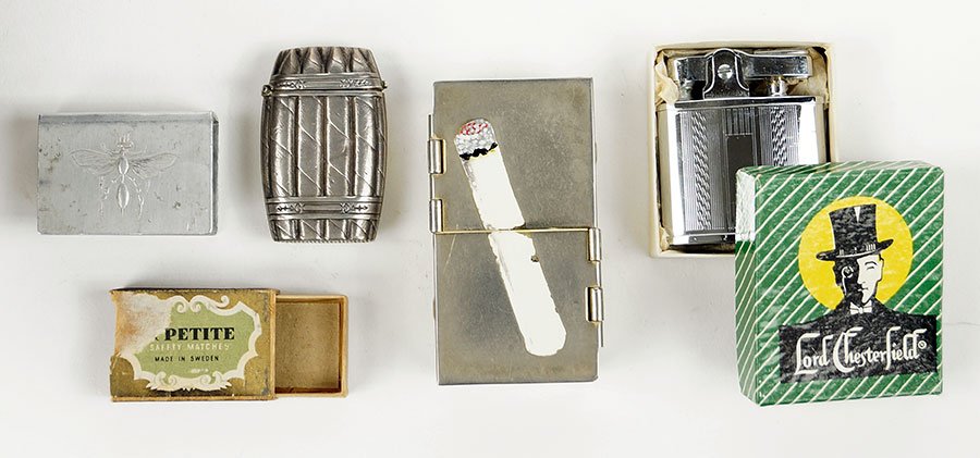 An Silver Cigar Band Match Safe.: An Silver Cigar Band Match Safe. Safe is .800 silver circa 1880, depicts a band of cigars, and is hallmarked with the double boars head. Together with a Lord Chesterfield lighter in the original box, 