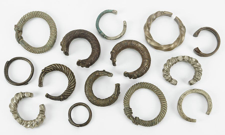 A Collection Of Four Yoruba Metal Currency Bracelets. (1 of 1)