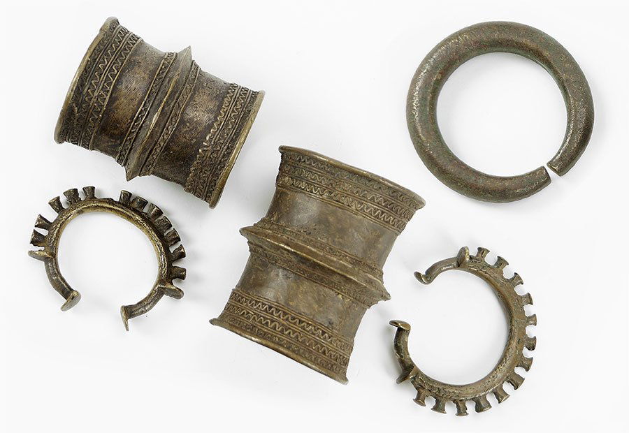 A Collection Of Five Benin Metal Currency Bracelets. (1 of 1)