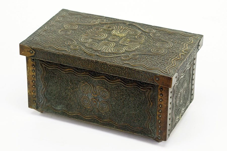 Attributed to Carl Otto Czeschka (1878-1960): A Repous: Attributed to Carl Otto Czeschka (1878-1960): A Repousse Jewelry Casket. Metal clad wood box is decorated with Jugendstil motifs in swirls and a textured / hammered like finish. Raised on four inverte