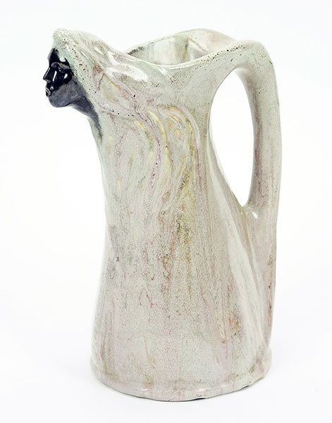 A Continental Glazed Pottery Pitcher. (1 of 2)