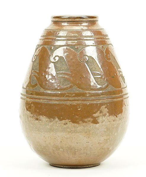 In The Style of Emile Lenoble (1875-1940) A Vase.: In The Style of Emile Lenoble (1875-1940) A Vase. Iridescent glazed earthenware vase depicts stylized curled elements within incised rings on the top and bottom. Underside bears incised marking Height