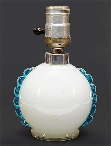 Attributed to Loetz: A Table Lamp.: Attributed to Loetz: A Table Lamp. Opalescent glass vase with applied clear blue handles has been drilled and retrofitted as a table lamp Glass height: 4"