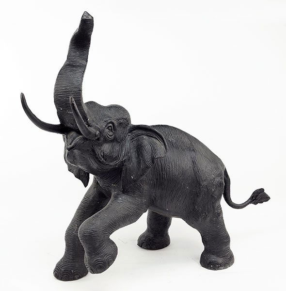 A Patinated Cast Bronze Elephant Figure. (1 of 1)
