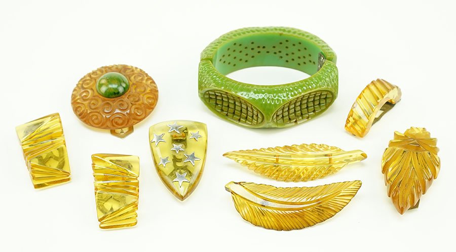 An Olive Green Carved And Filigree Bakelite Clamper (1 of 1)