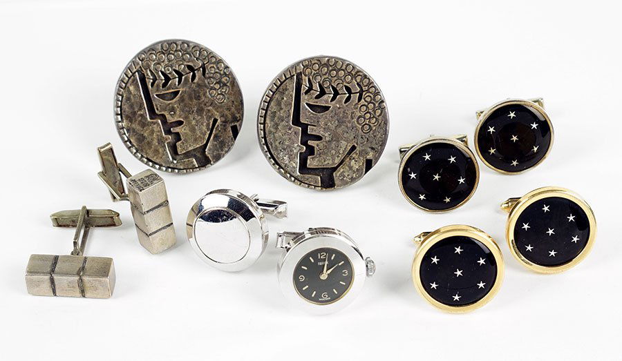 A Pair Of Swank Watch Cufflinks.: A Pair Of Swank Watch Cufflinks. One cufflink contains a watch. Together with a pair of Mexican sterling silver cufflinks bearing illegible maker's mark, a pair of Krementz goldtone and enamel cufflin