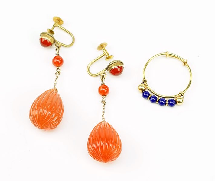 An 18 Karat Yellow Gold And Bead Ring.: An 18 Karat Yellow Gold And Bead Ring. Together with a pair of 14 karat yellow gold and carnelian briolette earrings. Each screwback earring contains three carnelian stones Ring Weight: 1.8 grams Ring