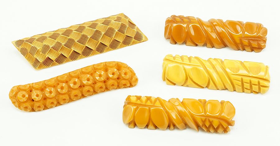A Group Of Three Honey Bakelite Carved Brooches. (1 of 1)
