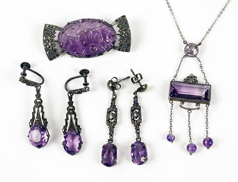 An Art Deco Amethyst And Silver Necklace.: An Art Deco Amethyst And Silver Necklace. Together with a pair of amethyst, marcasite, and silver screwback earrings, an additional pair of amethyst postback earrings, and a carved amethyst, marcasite