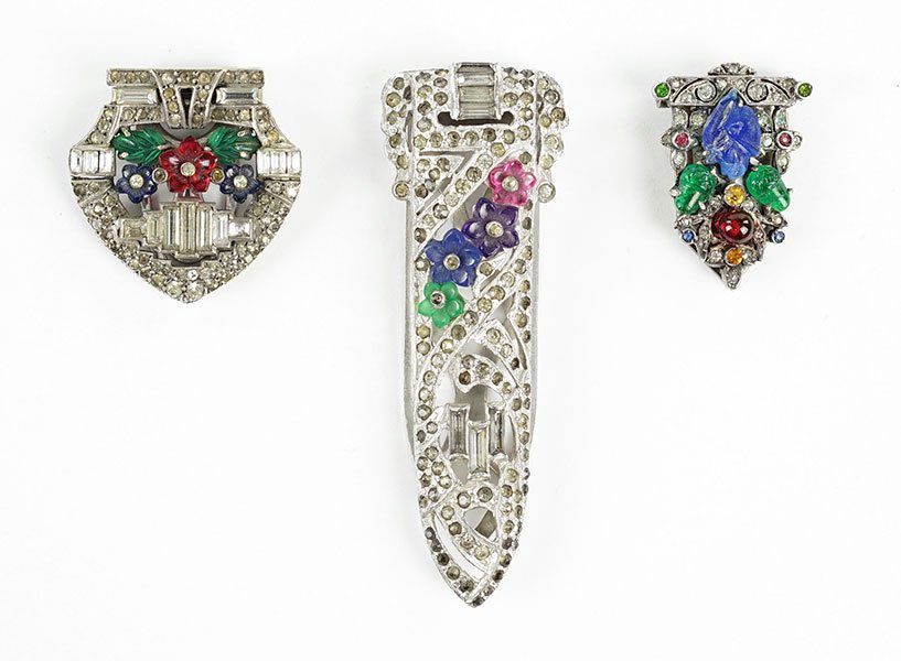 A Ciner Sterling Silver And Tutti-Frutti Rhinestone: A Ciner Sterling Silver And Tutti-Frutti Rhinestone Dress Clip. Together with two additional tutti-frutti rhinestone and silvertone dress clips Ciner: 1.25"