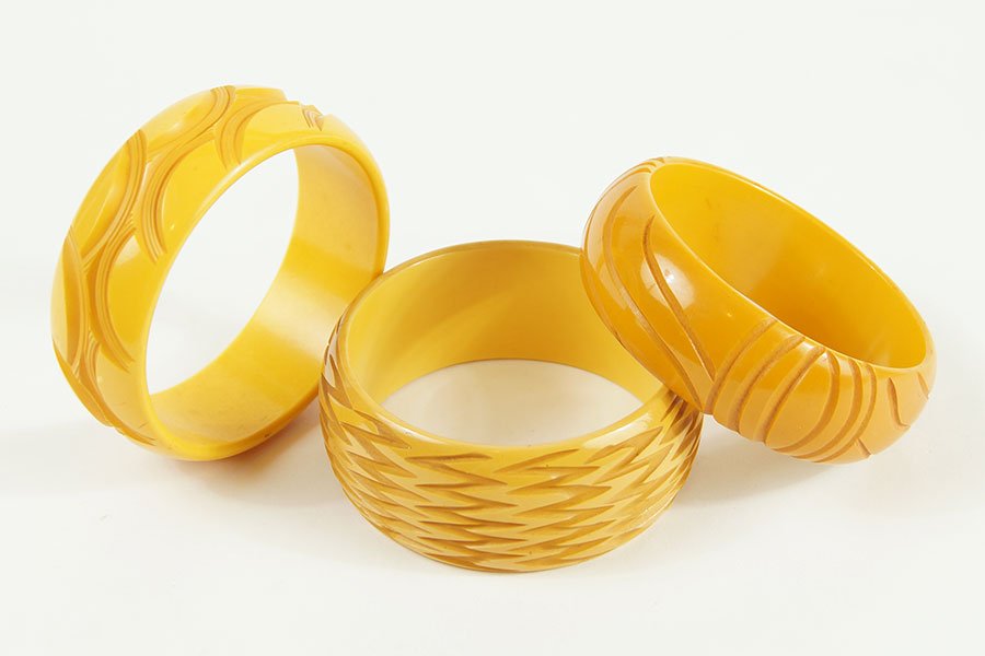Three Yellow Carved Bakelite Bangle Bracelets. (1 of 1)