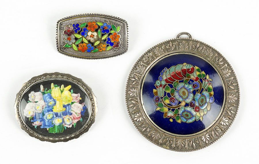 A Karl Johann Bauer Art Nouveau Silver Brooch.: A Karl Johann Bauer Art Nouveau Silver Brooch. Depicting a painted flower decoration on front, stamped .800 and maker's marks on reverse. Together with a cloisonne pendant in the style of Hermann Haus