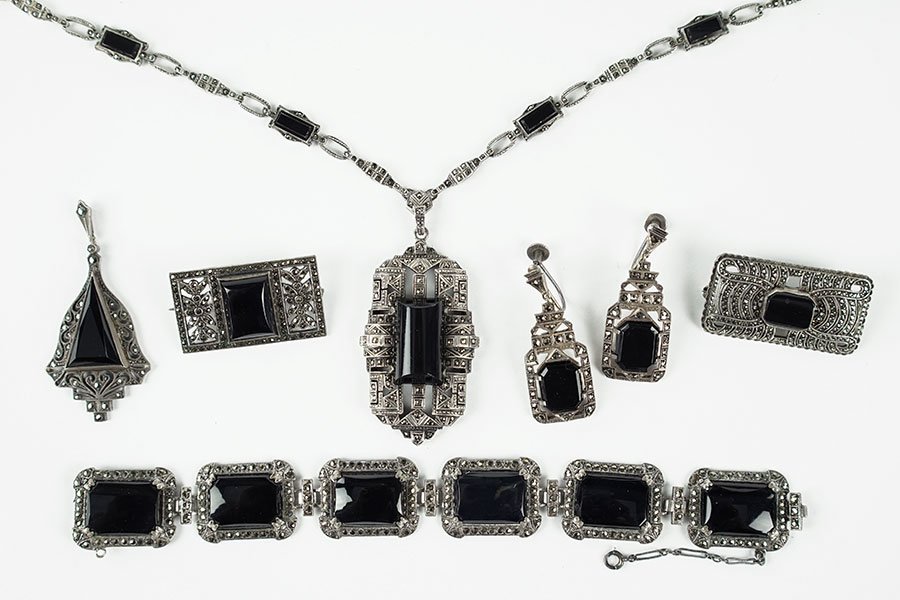 An Onyx, Marcasite, And Sterling Silver Pendant: An Onyx, Marcasite, And Sterling Silver Pendant Necklace. Containing eight onyx stones on necklace chain and one cabochon onyx in the center of the pendant. Together with a suite of onyx, marcasite, a
