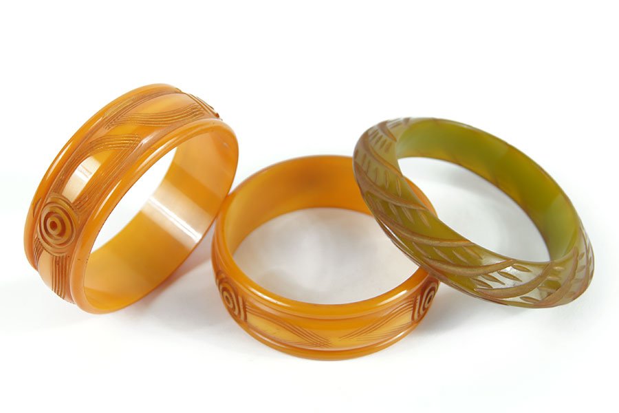 A Pair Of Carved Honey Bakelite Bangle Bracelets. (1 of 1)